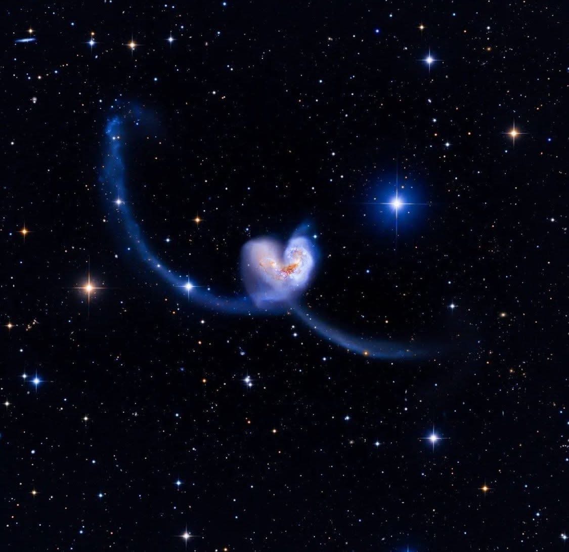 Two galaxies forming a heart in space